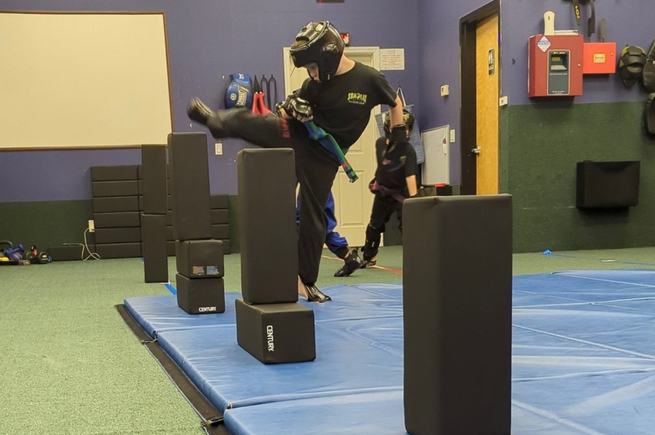 Martial arts instructor with kids