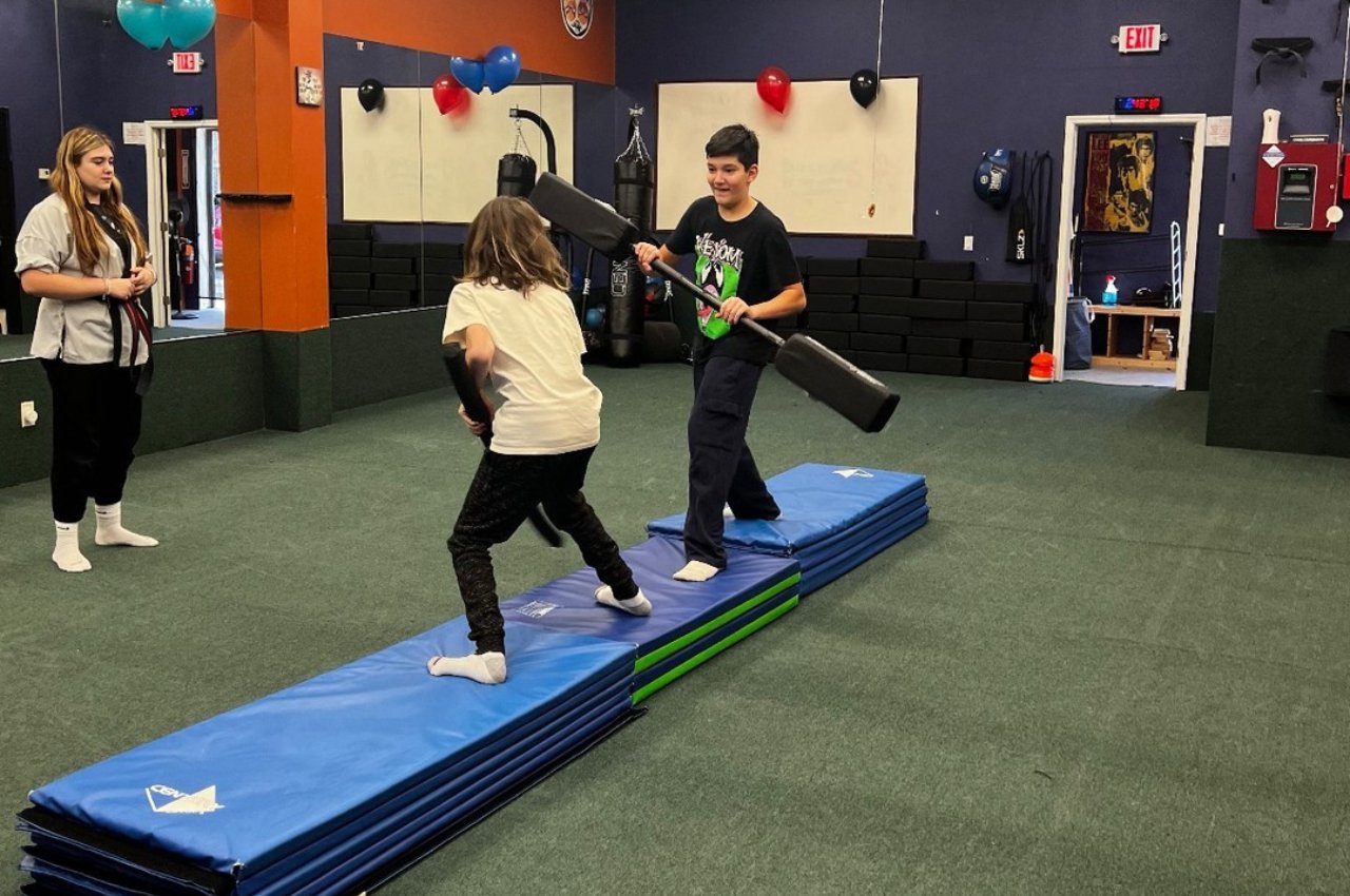 Martial arts instructor with kids