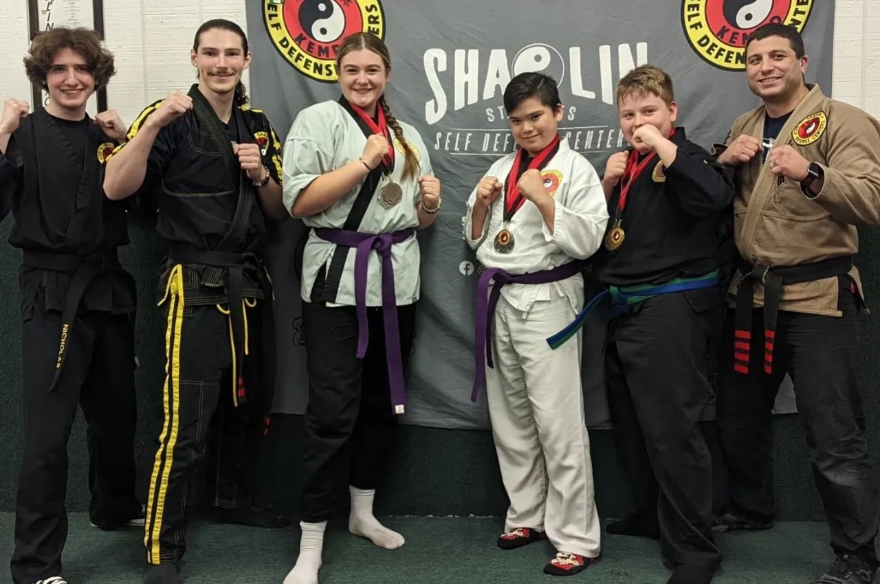 Martial arts instructor with kids