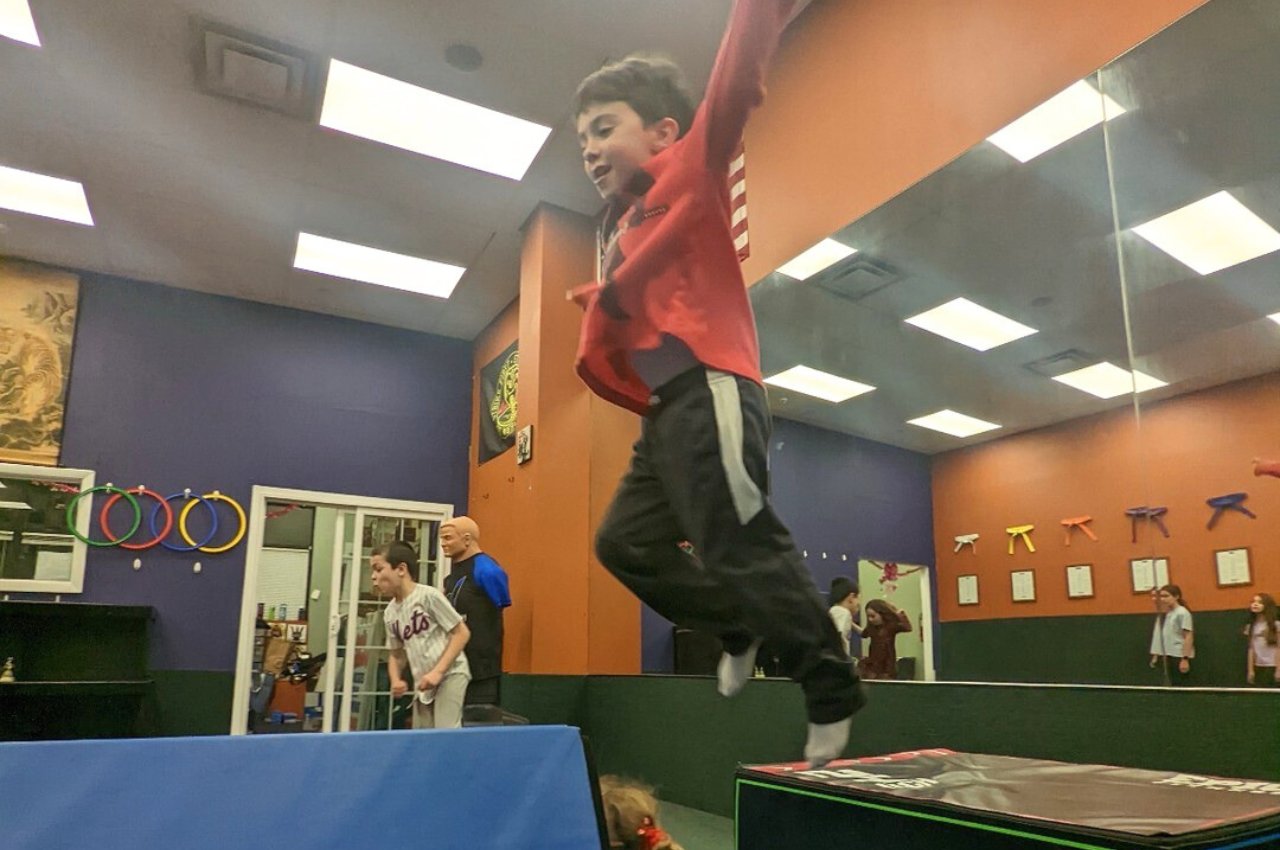 Martial arts instructor with kids