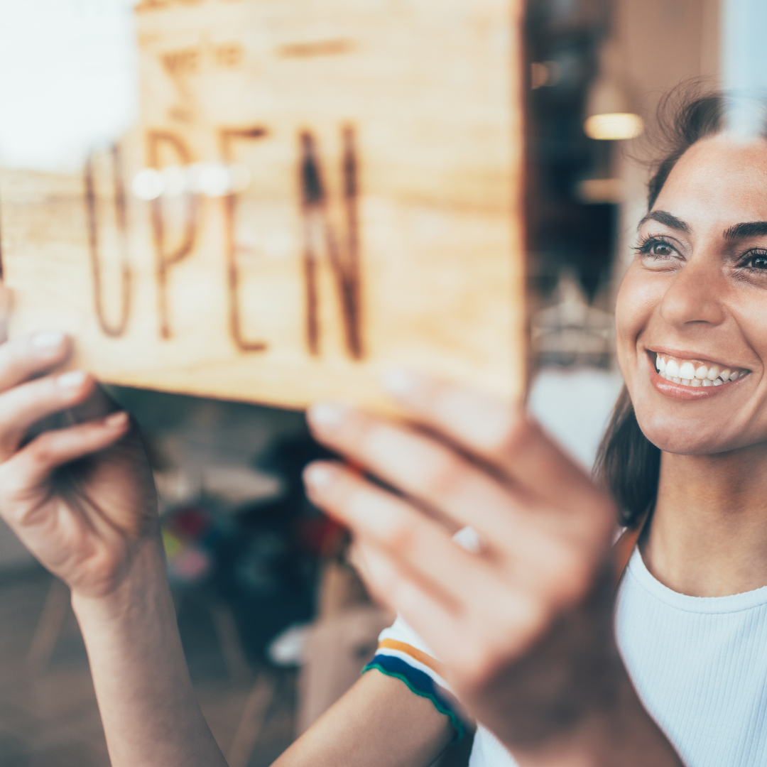 Small business owner open sign