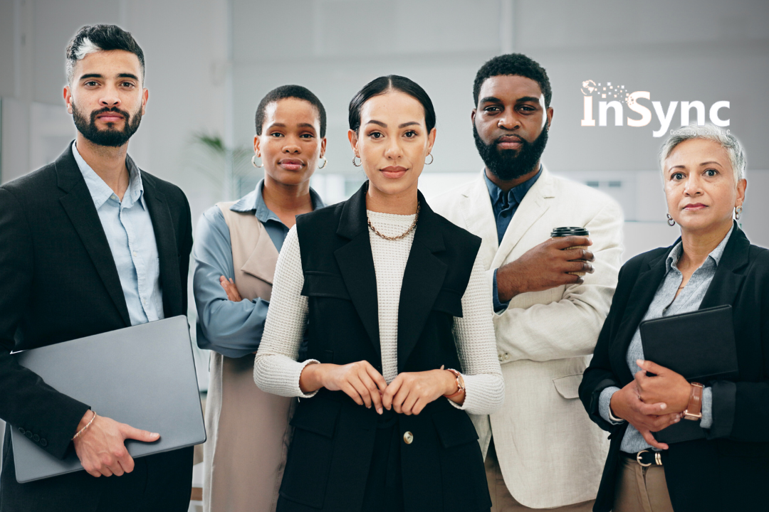 A confident group of diverse business professionals posing together in a bright office environment, symbolizing leadership, teamwork, and corporate unity. A confident group of diverse business professionals posing together in a bright office environment, symbolizing leadership, teamwork, and corporate unity.