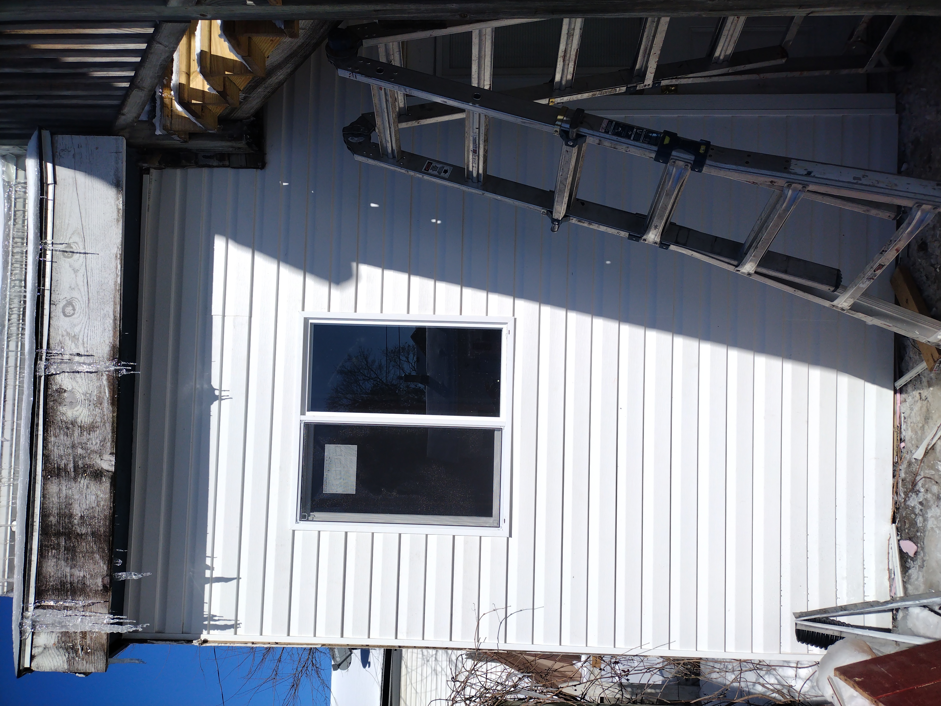 Beautiful after image of the siding restoration performed by Scott