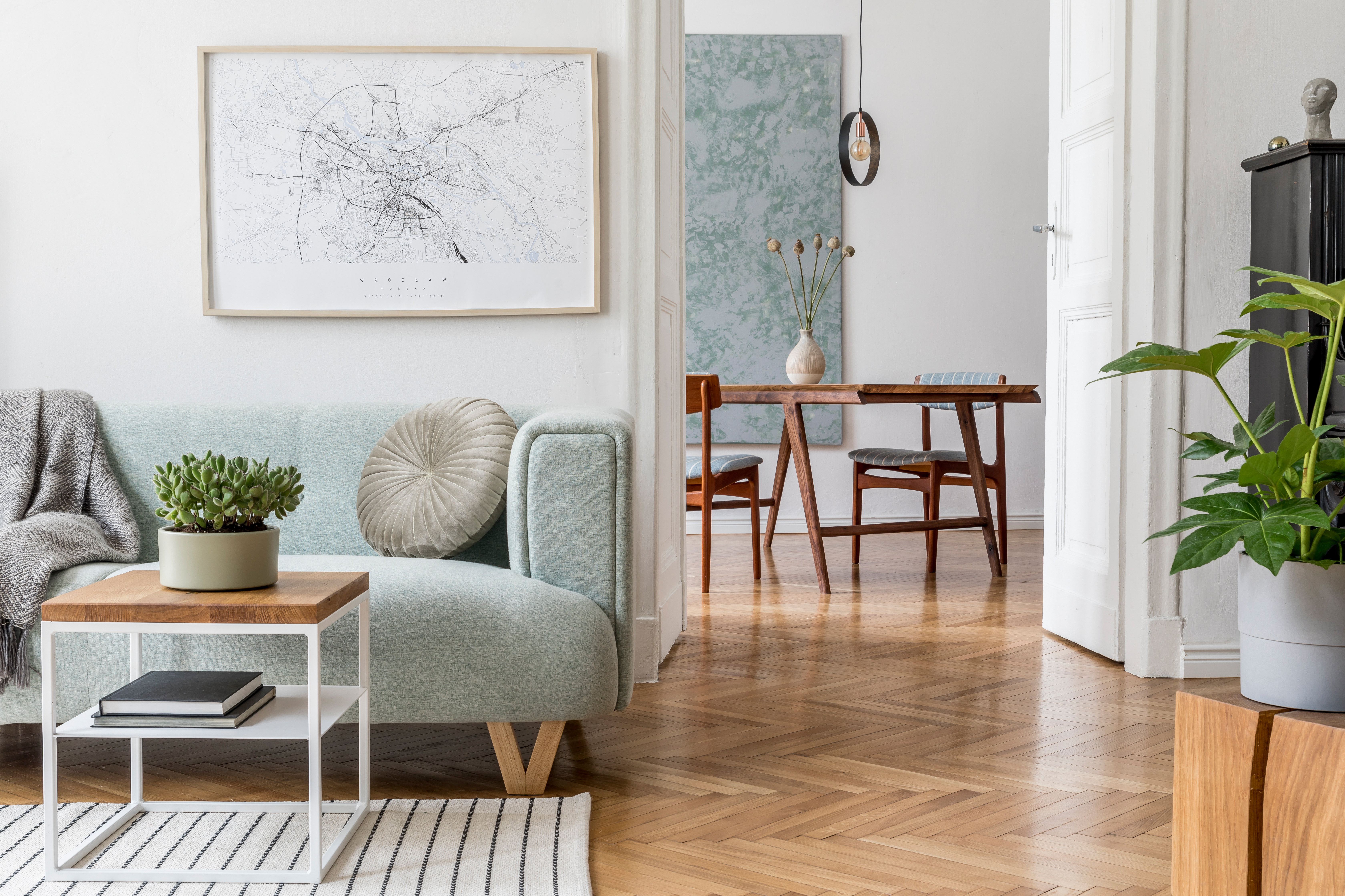 Residential interior showcasing herringbone hardwood flooring in a bright living space. Residential interior showcasing herringbone hardwood flooring in a bright living space.