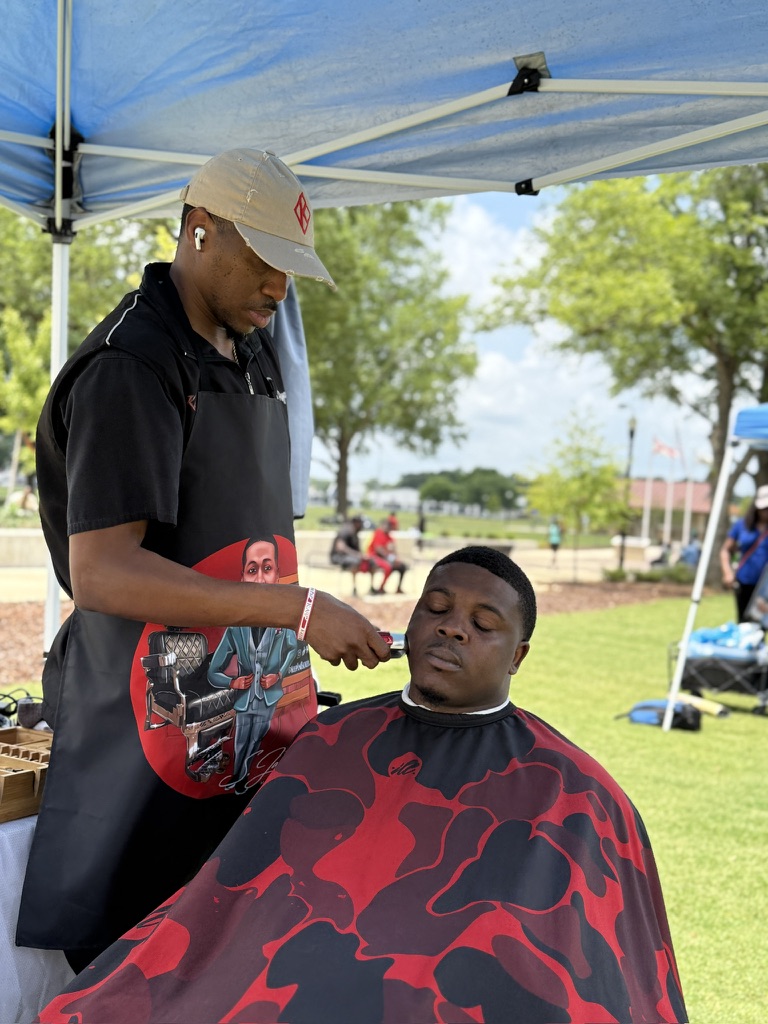 Keep Em Sliced doing free haircut during Fathers in the Park event Keep Em Sliced doing free haircut during Fathers in the Park event
