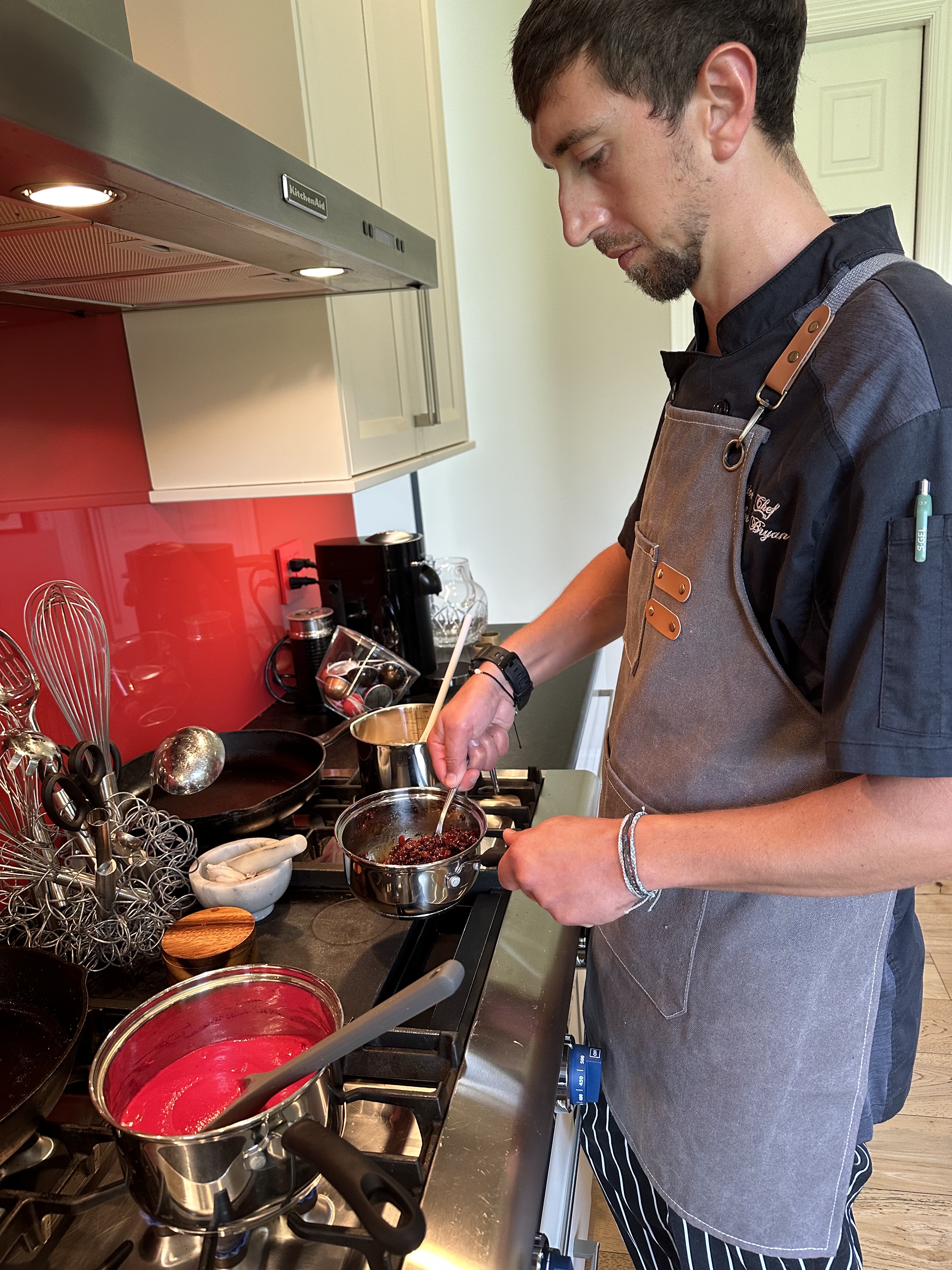 Chef Schyler preparing gourmet dishes with precision and passion