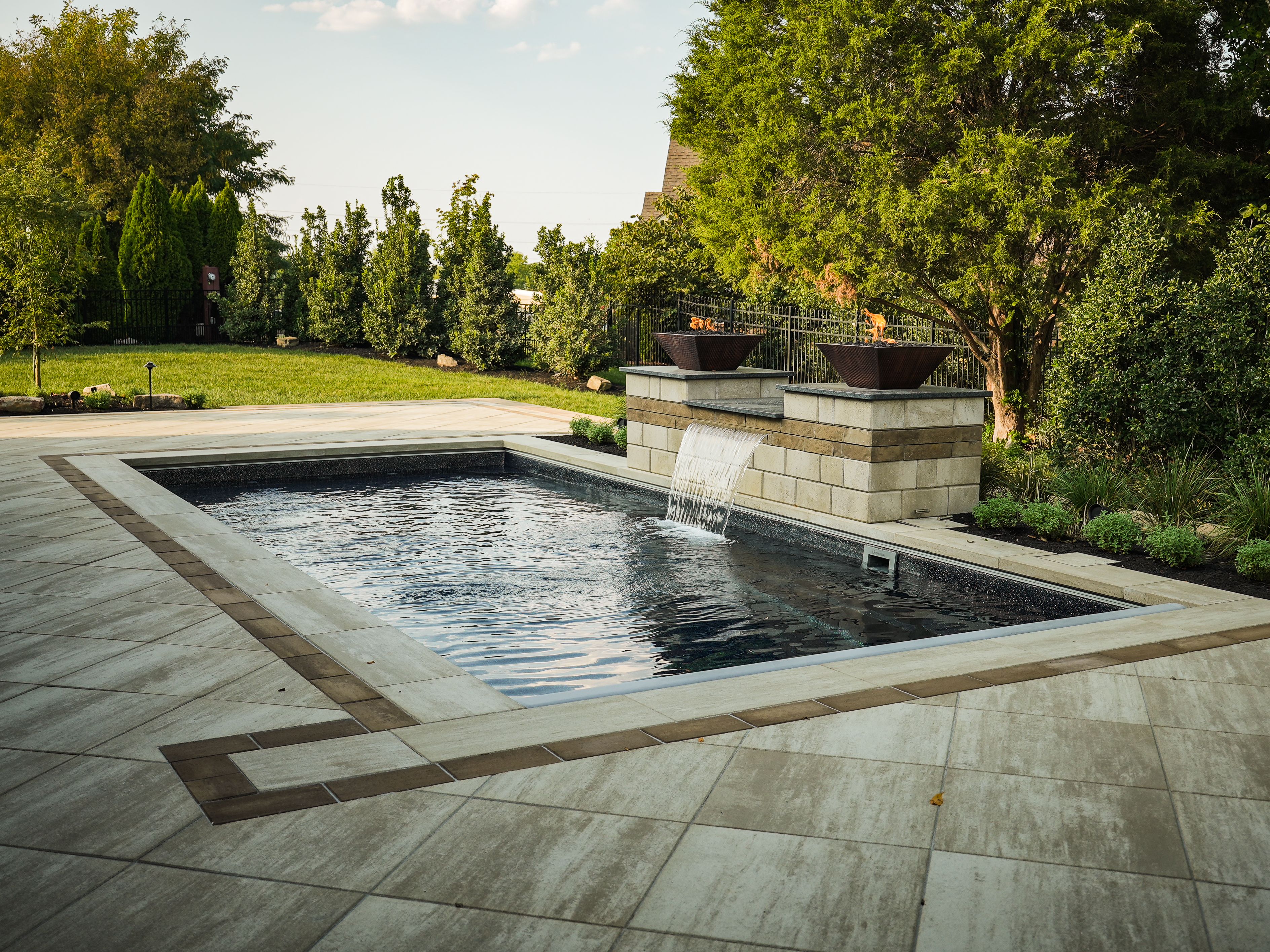 Luxury backyard pool design by Get Mowtivated