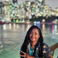 Kwanza Clay Bowe, owner of Chat 'N' Chill® and founder of A Wedding Breeze, Exuma's premiere destination wedding and event planning company.