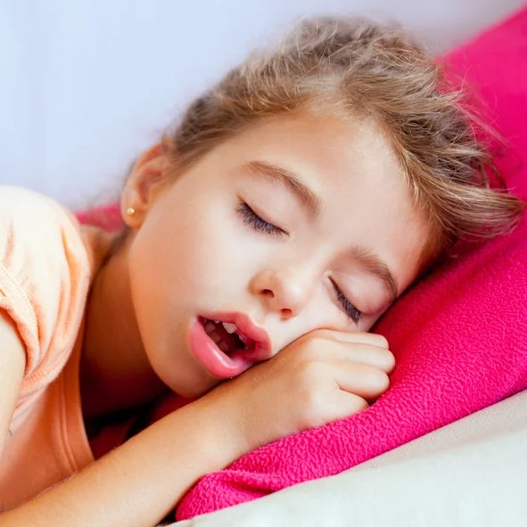 A child sleeping with mouth open