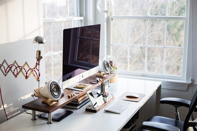 Ergonomic desk with monitor at eye level, keyboard and mouse within reach Ergonomic desk with monitor at eye level, keyboard and mouse within reach
