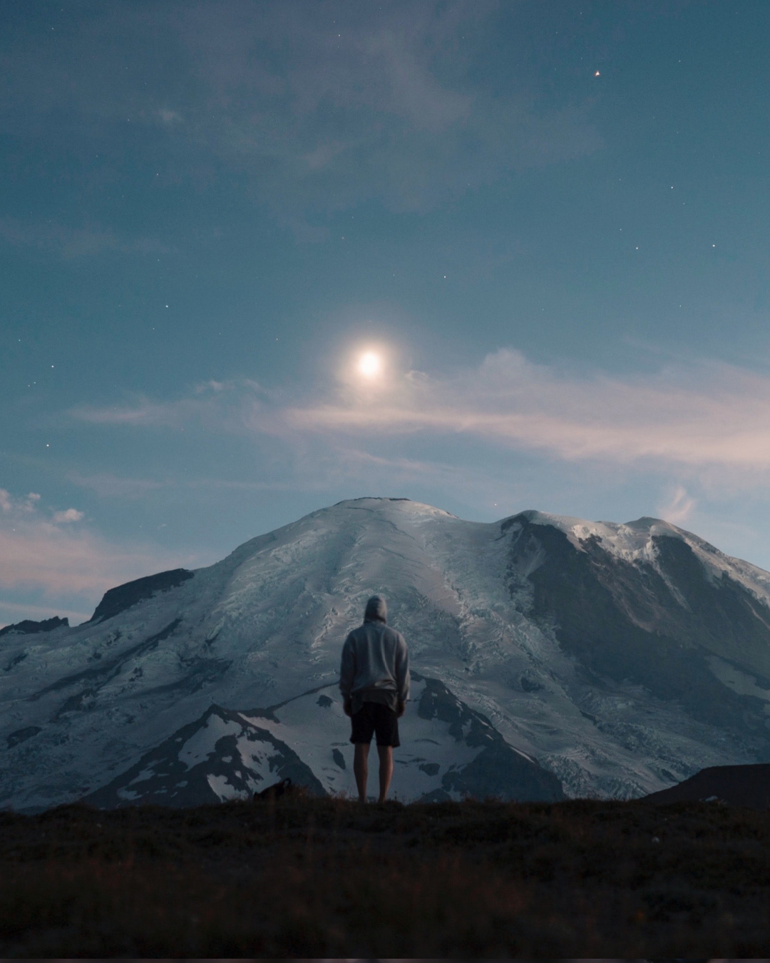 A person standing still, looking outward (not running or reaching) A person standing still, looking outward (not running or reaching)