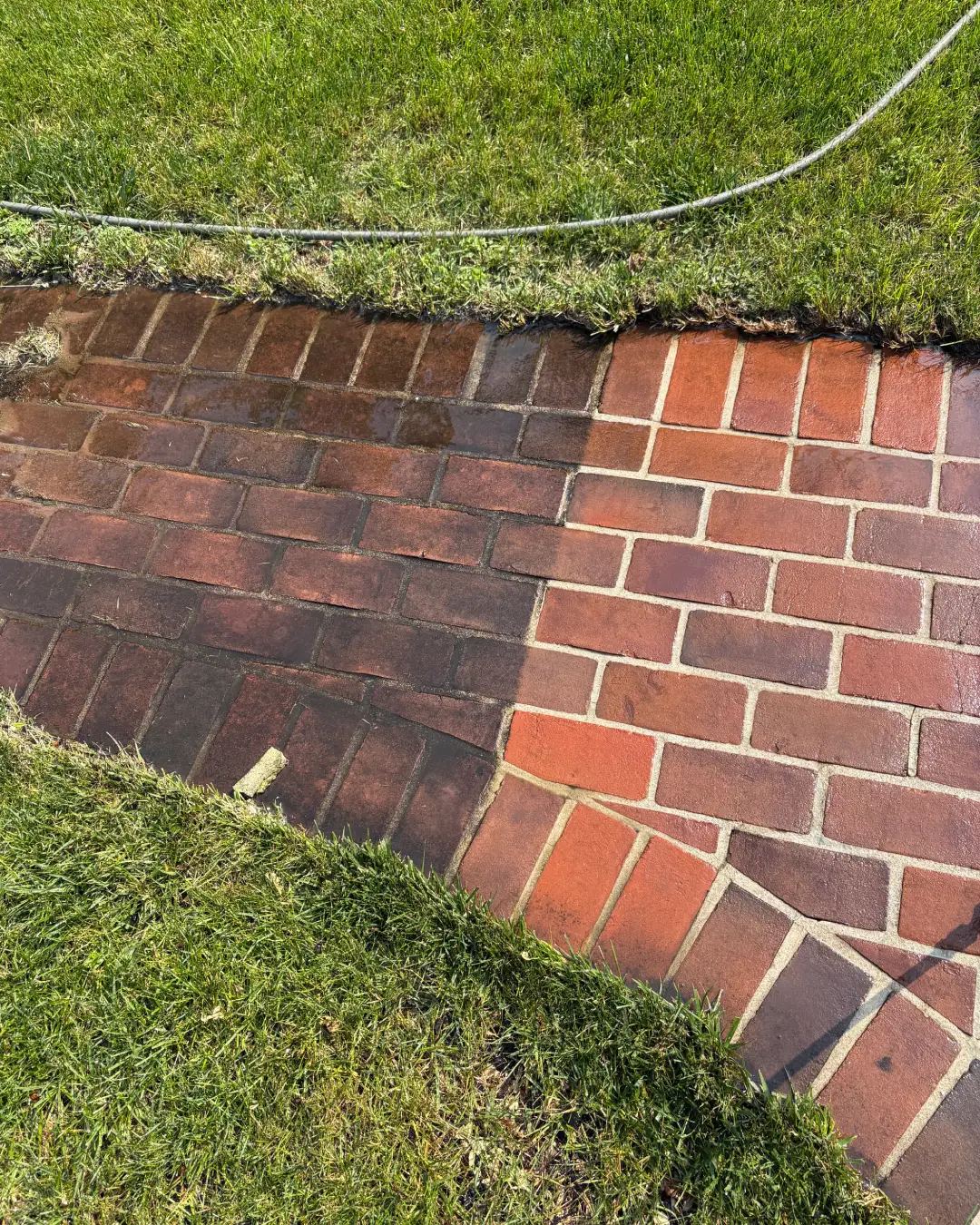 Professional pressure washing a brick patio in New Jersey
