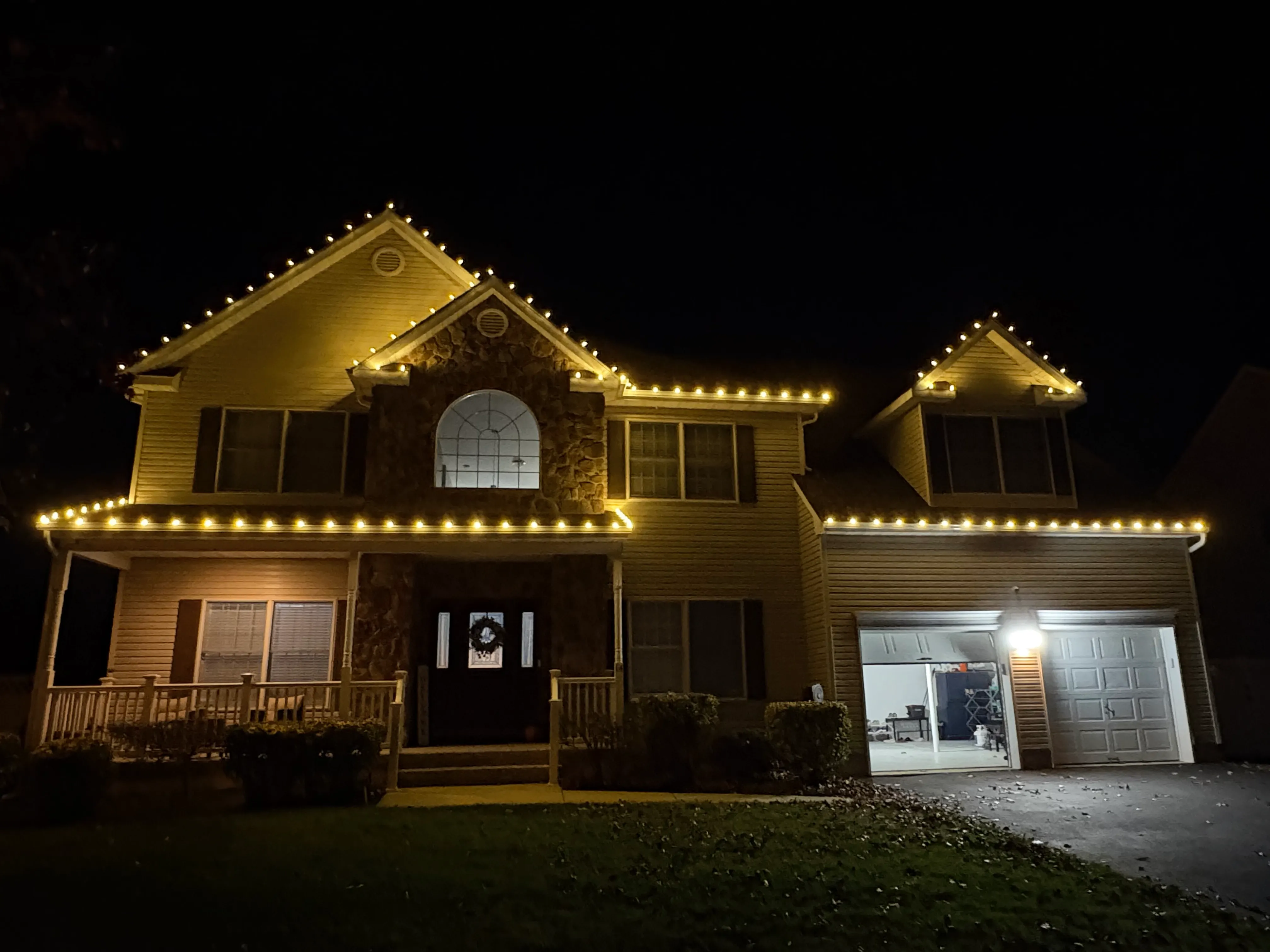 Christmas lights on a Brick NJ home at dusk