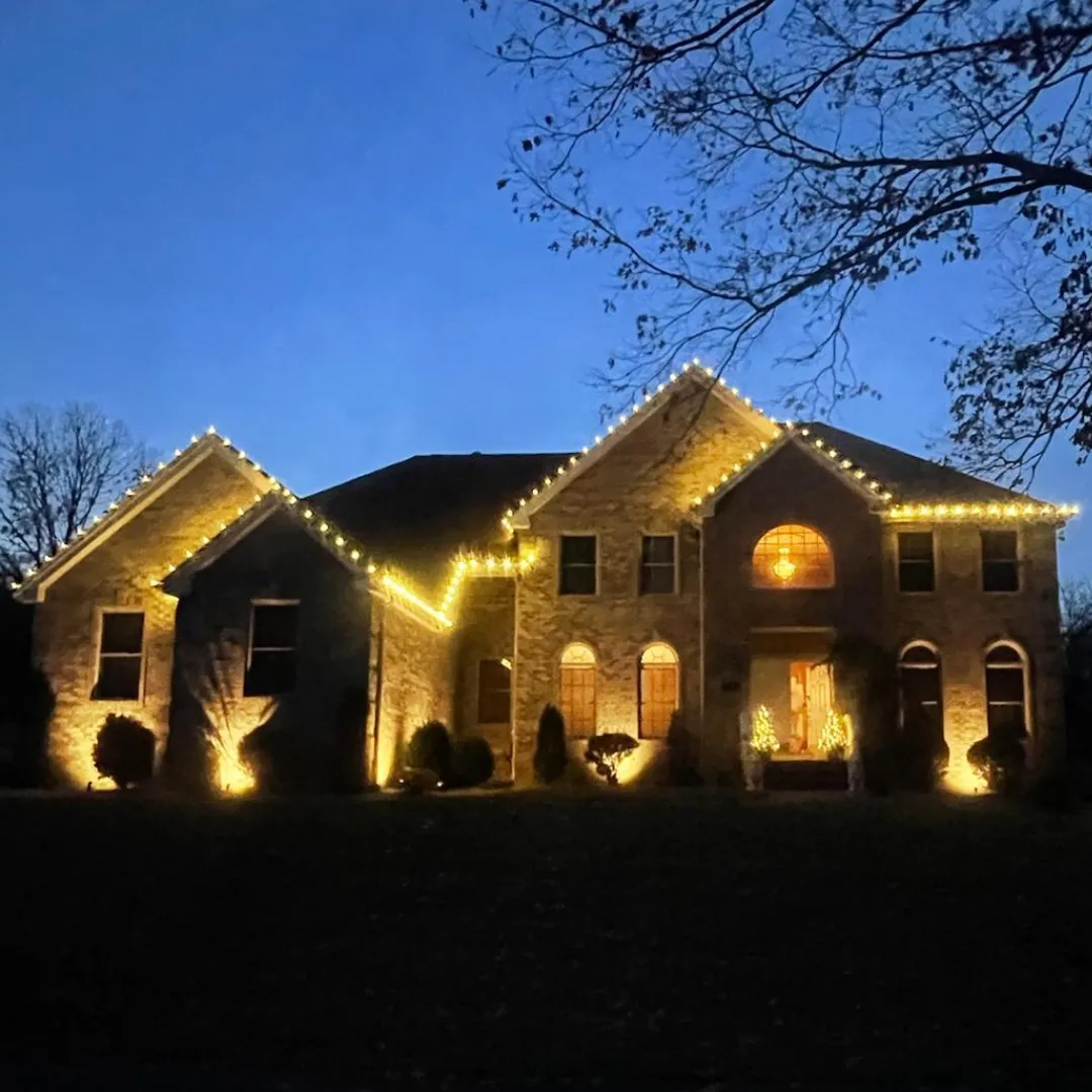 Christmas lights installed along roofline of a New Jersey home
