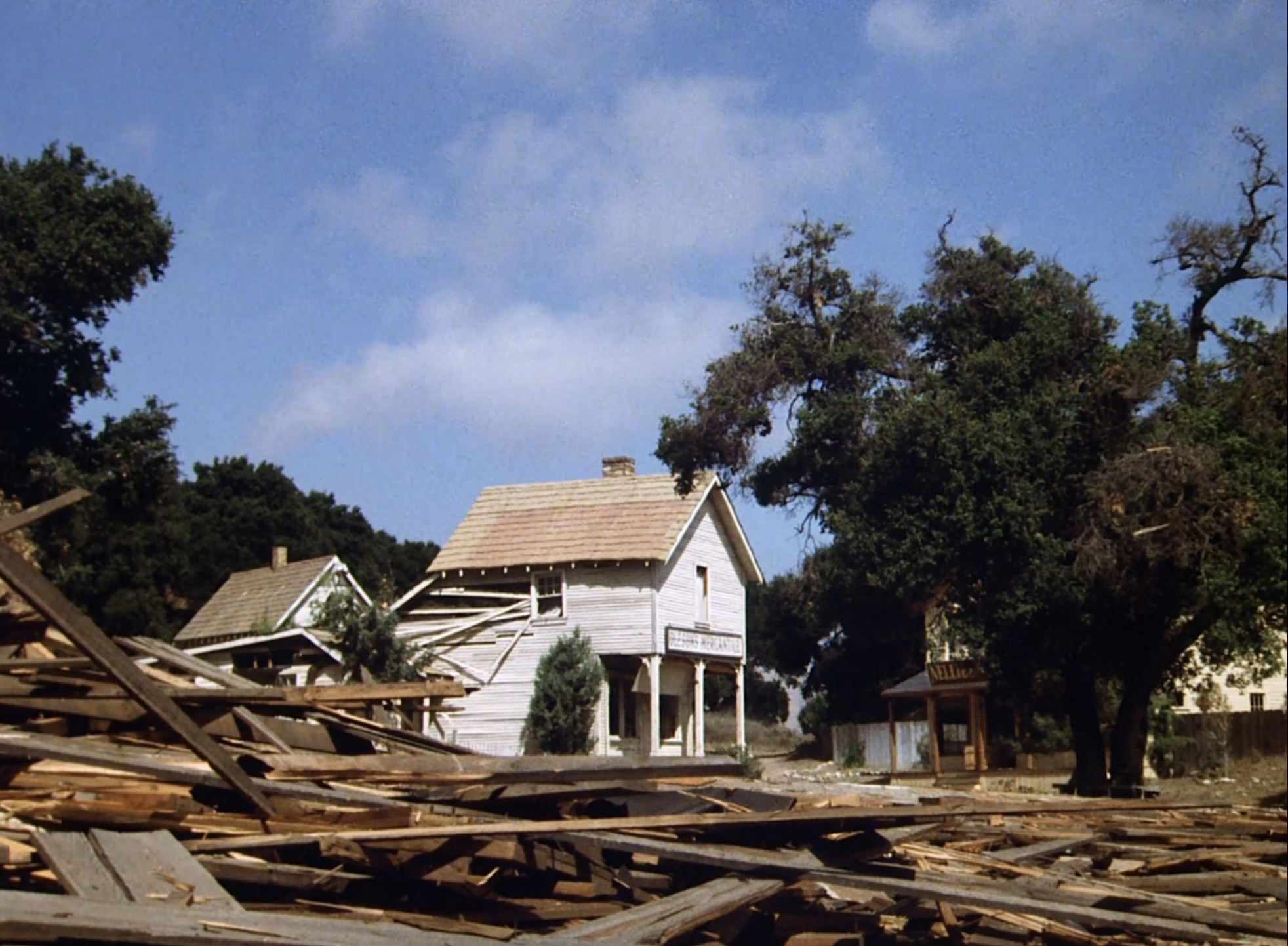 The Walnut Grove mercantile standing amid rubble before its destruction in Little House on the Prairie
