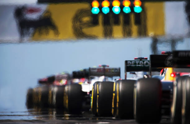 Rear view of the start of a Formula 1 race, symbolizing the precision, speed, and strategic decision-making required in today's competitive Medicare insurance field.