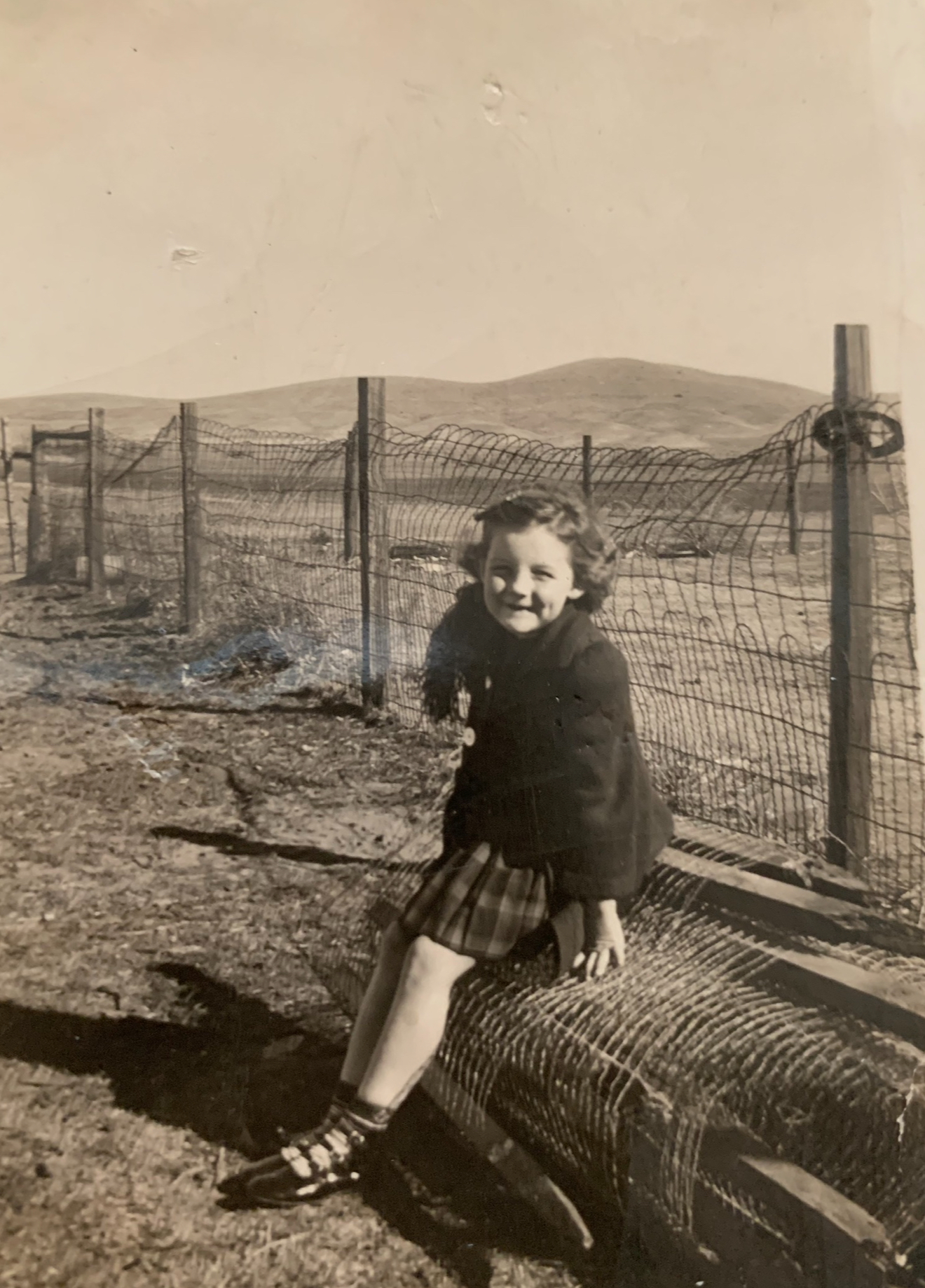 Young girl in childhood portrait, symbolizing resilience while growing up with a bipolar mother, representing the author’s early life struggles and journey of healing.