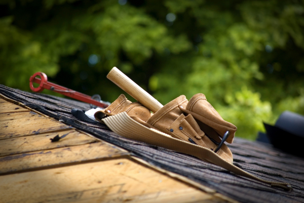 Man roofing a house whose business benefits from digital marketing strategies. Man roofing a house whose business benefits from digital marketing strategies.