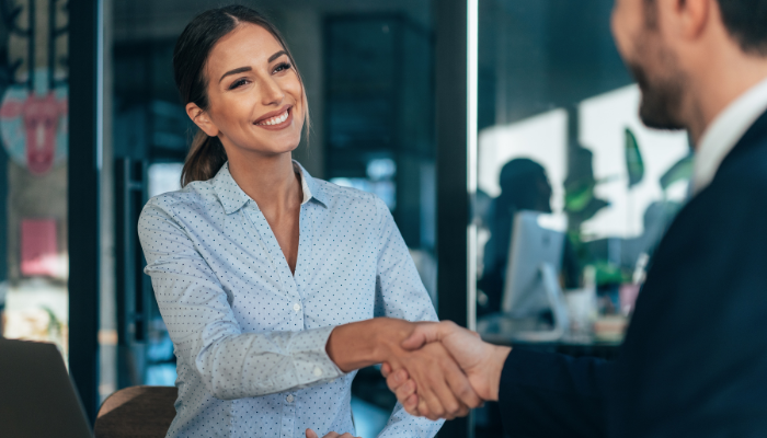 Lady shaking man's hand Lady shaking man's hand