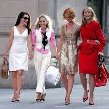 Still from Sex and The City with main characters walking on a New York street Still from Sex and The City with main characters walking on a New York street