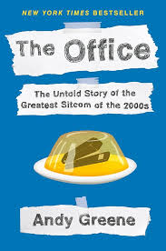 The front cover of the book. The Office - The Untold Story of the Greatest Sitcom of the 2000s by Andy Greene. It has an image of a stapler in jelly The front cover of the book. The Office - The Untold Story of the Greatest Sitcom of the 2000s by Andy Greene. It has an image of a stapler in jelly