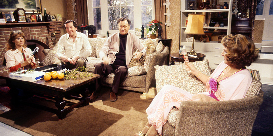 In the Good's living room. Barbara, Tom, Jerry and Margo are sat around a coffee table