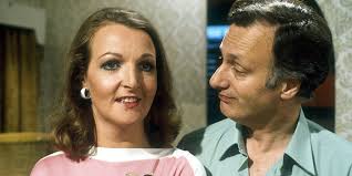 Margo looking off to the distance while Jerry stares at her.