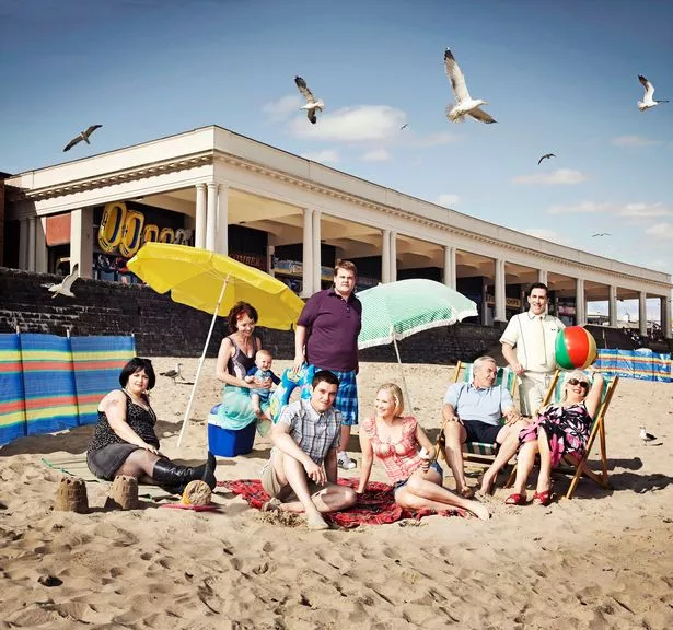 Cast of Gavin and Stacey sat on Barry Island beach front