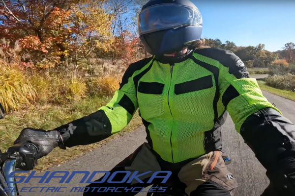 A close-up view of an electric motorcycle on Mars Hill's mountainous terrain, showcasing the bike's advanced technology and its harmony with the environment.