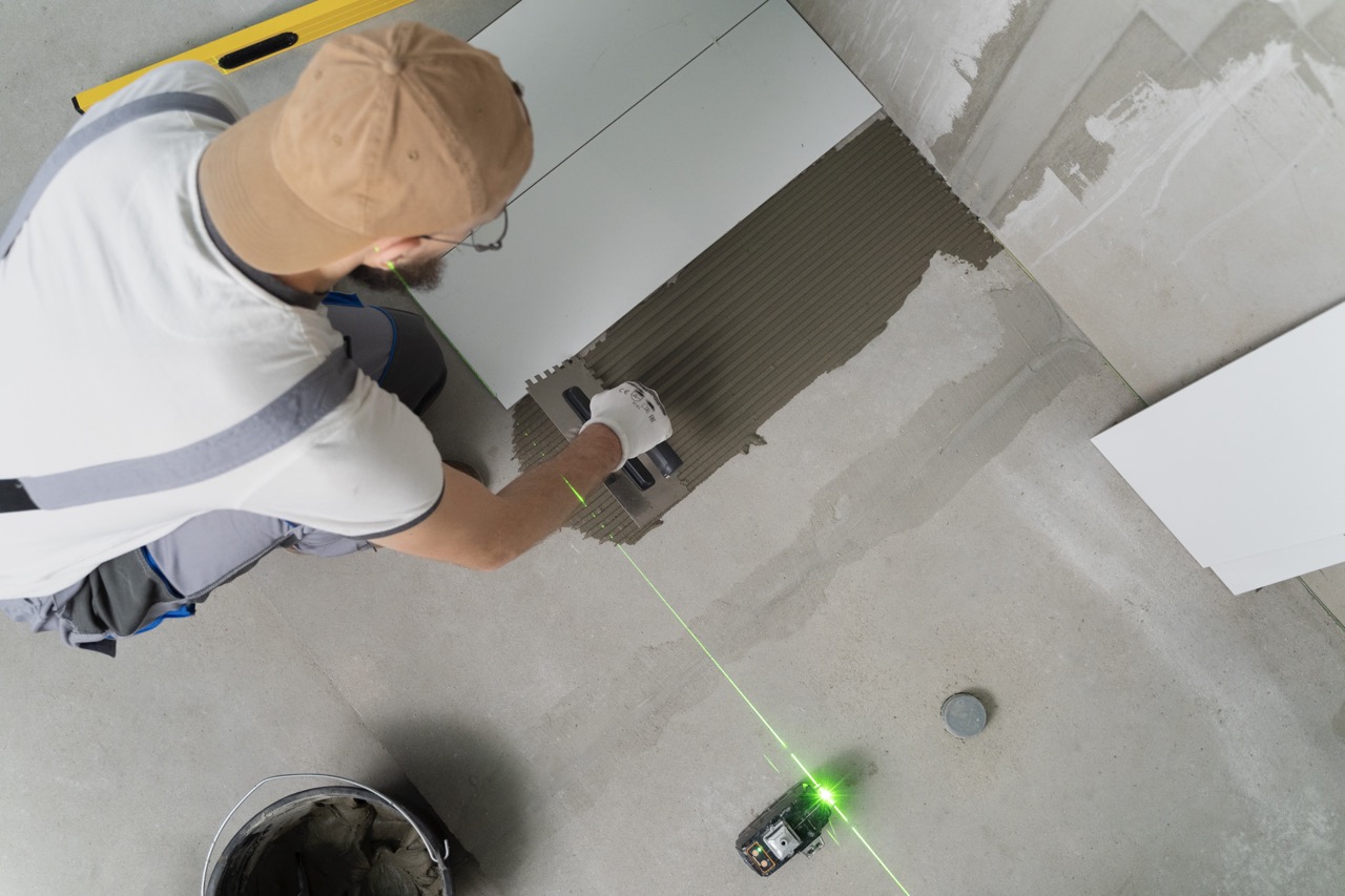 Tiler laying grout 