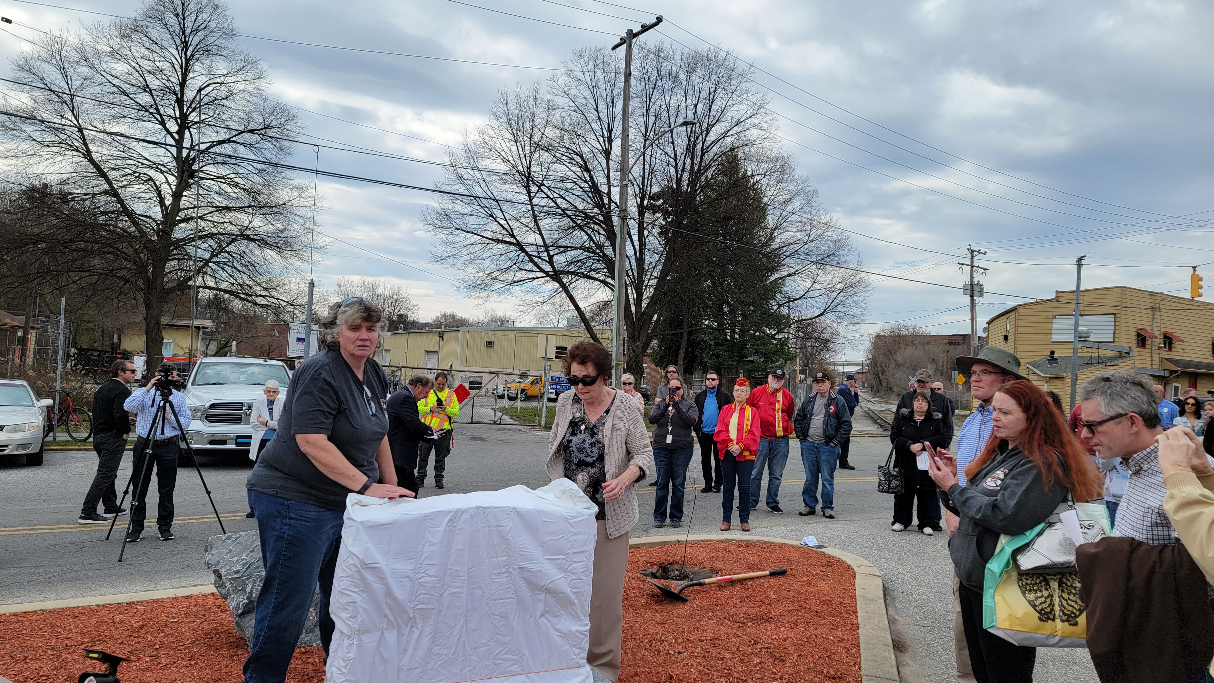 Karen and Judy unveiling the memorial stone