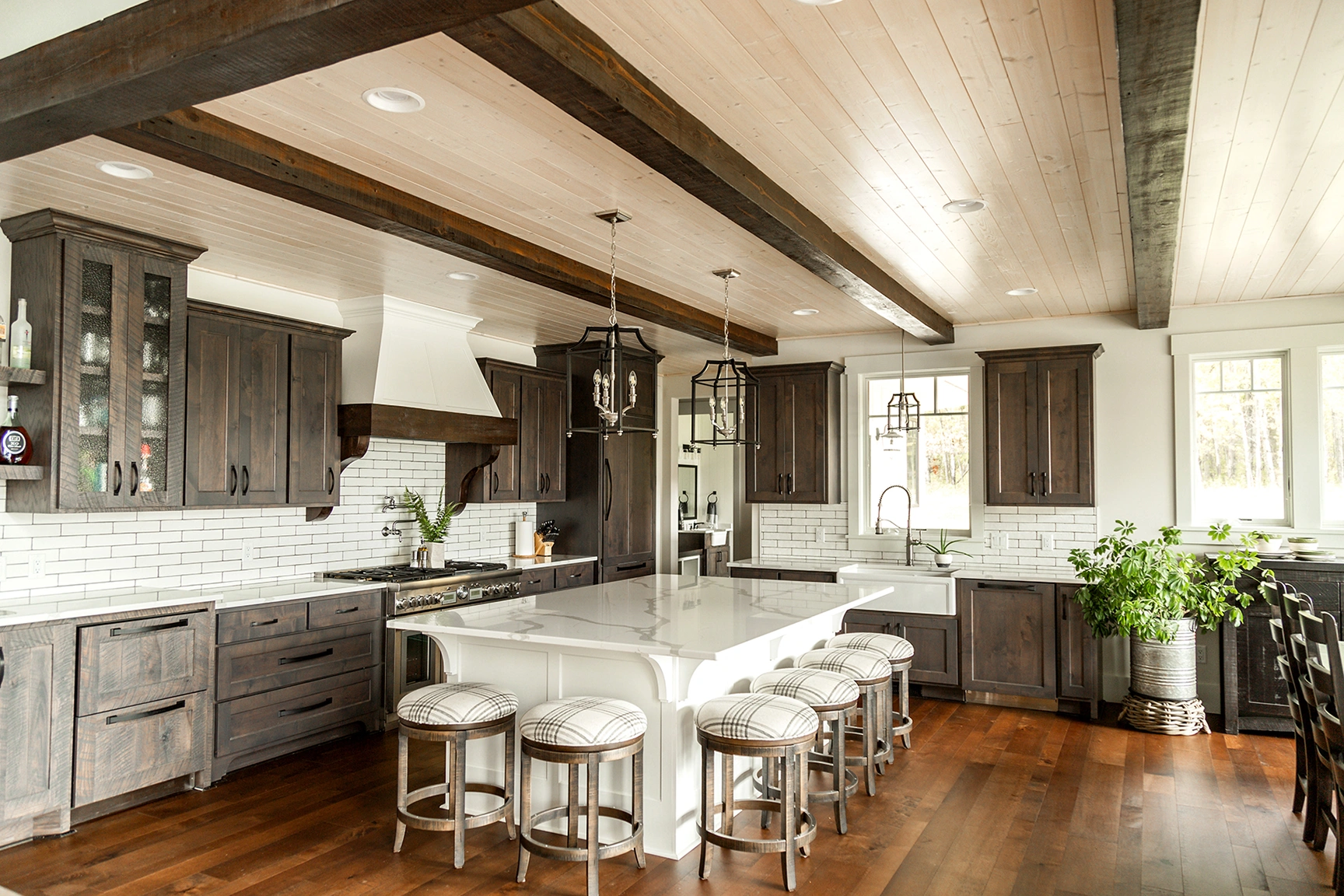 a beautiful kitchen cabinet with white marble countertops