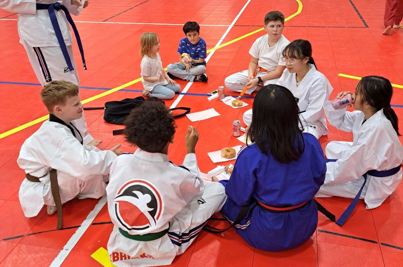 Martial arts instructor with kids