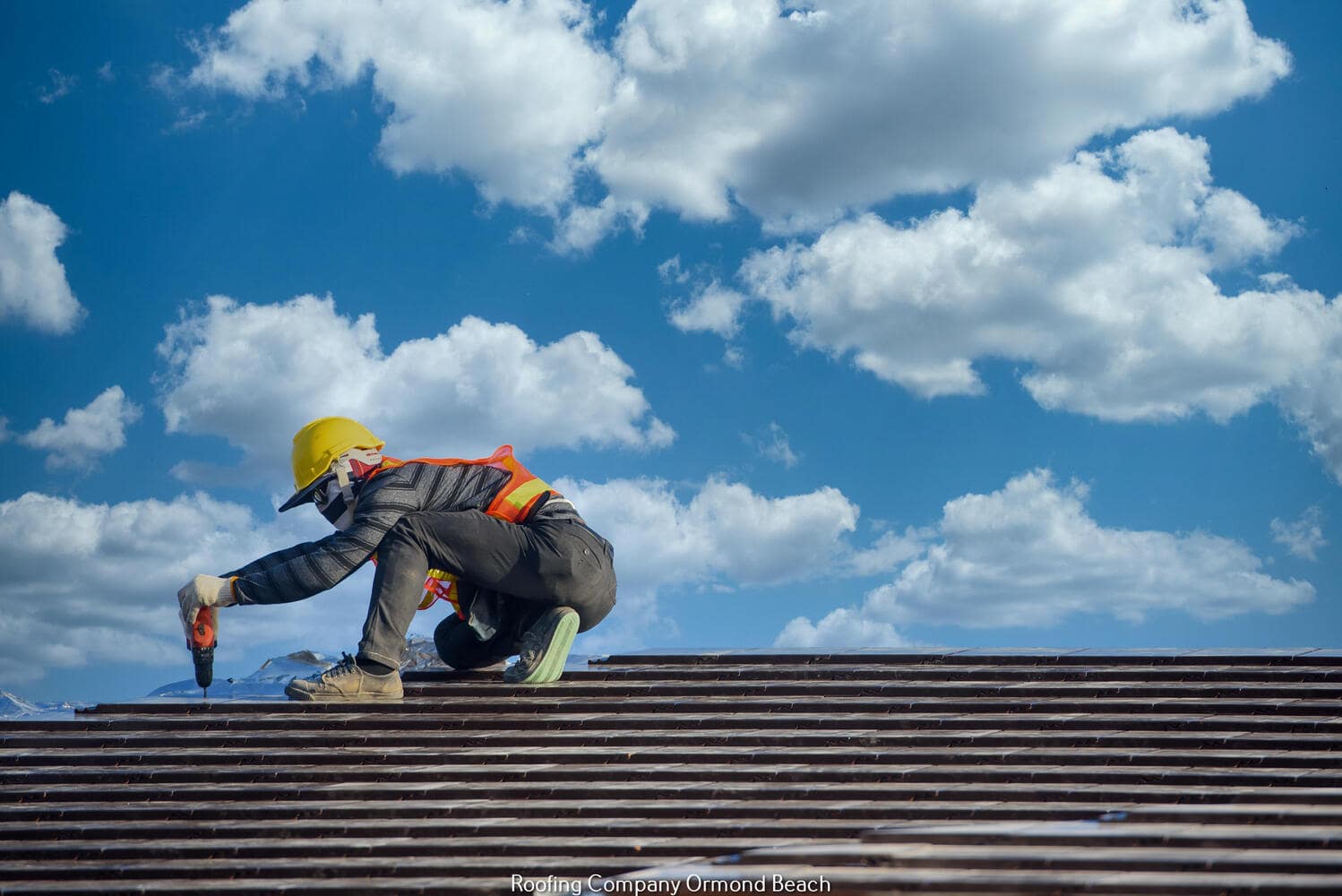 a silhouette of a person on a roof