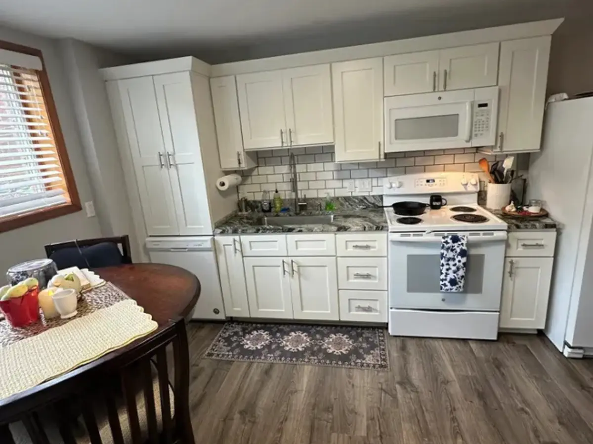 alt="A bright, beautiful kitchen in a Maryland home, sparkling clean after service from Crisp Clean Home."