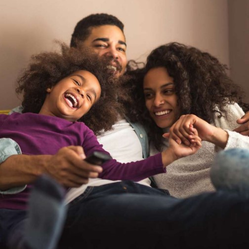 A family loving on each other having peace of mind and the security their family is protected.