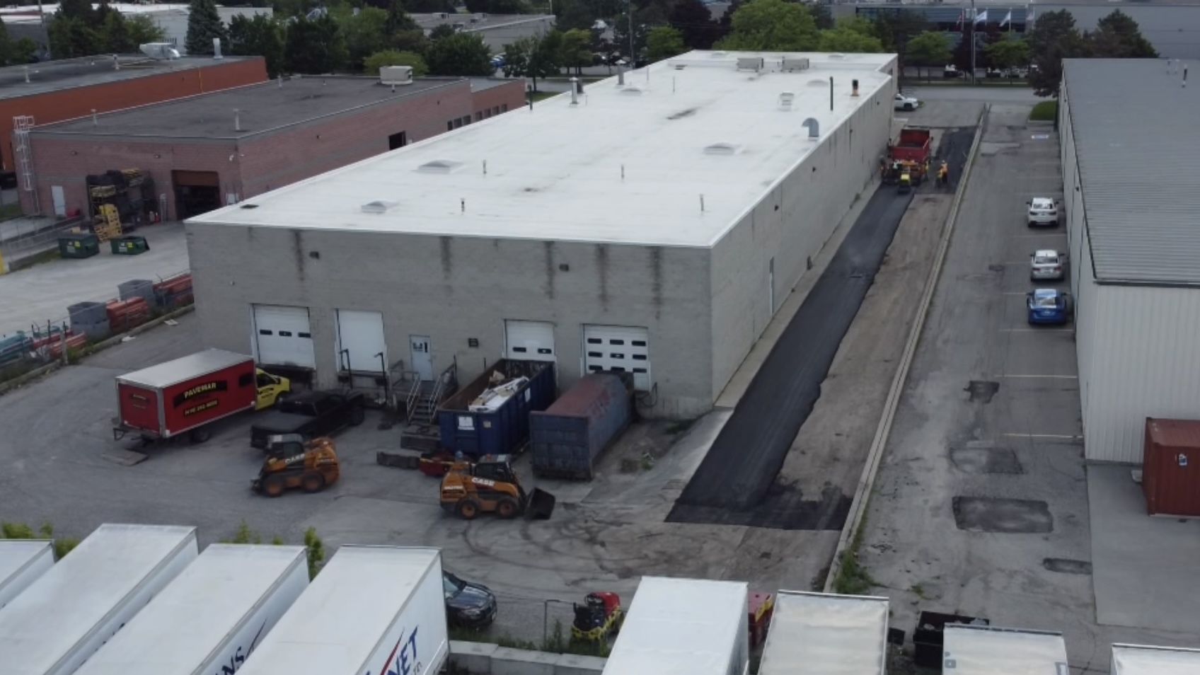 HL8 Base Coat of Asphalt on Commercial Building | Pavemar Paving