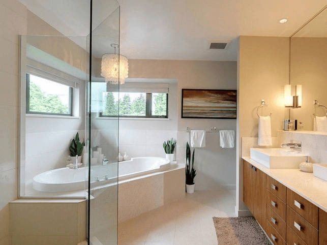 a bathroom remodeling showcases a luxurious soaking tub and elegant double vanity with natural light.