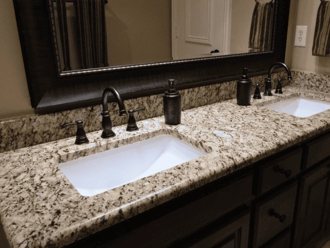 a sleek granite countertop and elegant double sink design.