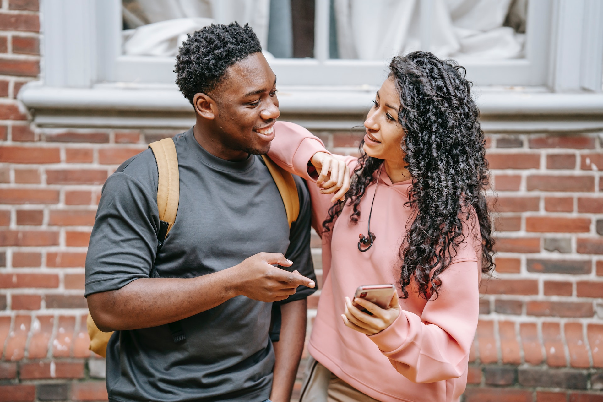 Heterosexual couple standing and staring at each other