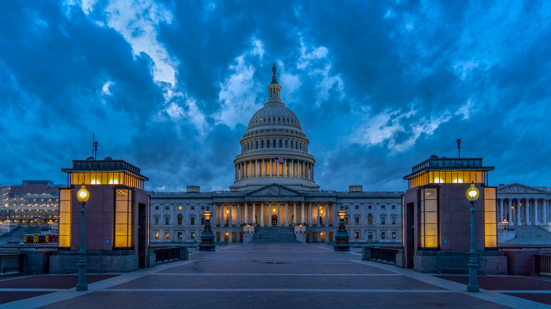 beautiful well lit building with bright lights and grey evening background