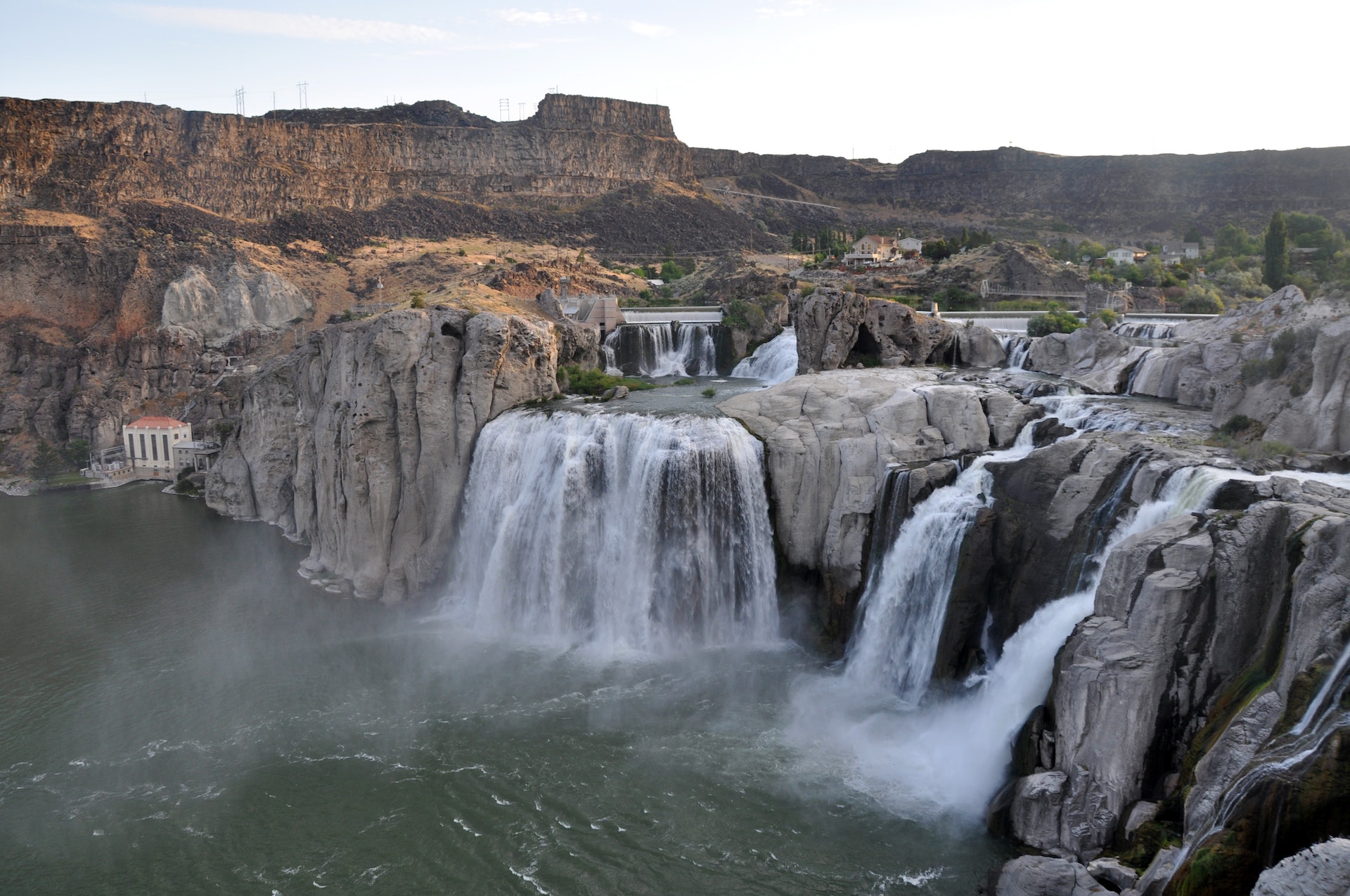 Small Waterfall surrounded by mountains in the background