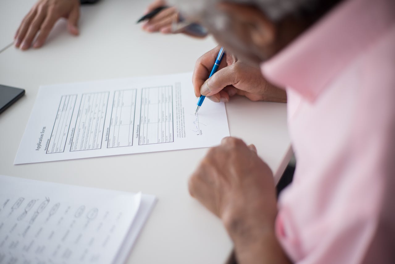 A man filing out an application form