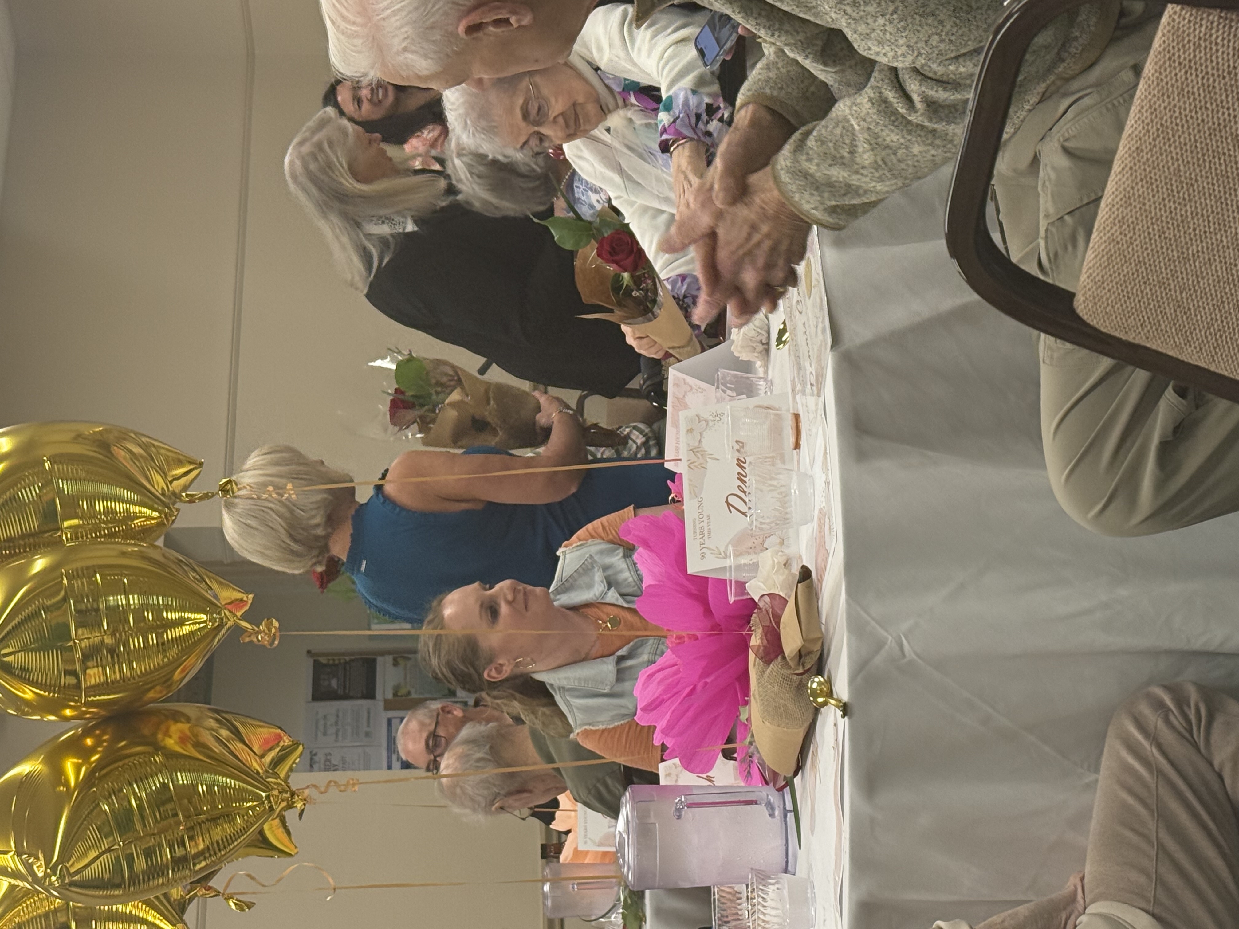 Smiling elderly couple with caretaker in New Milford, CT
