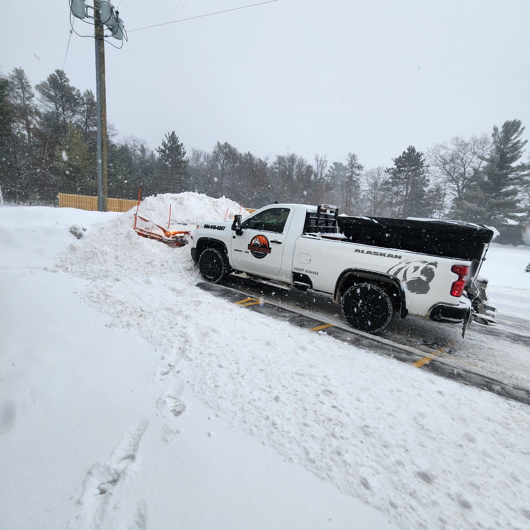 Landworks plow truck on a snow removal job