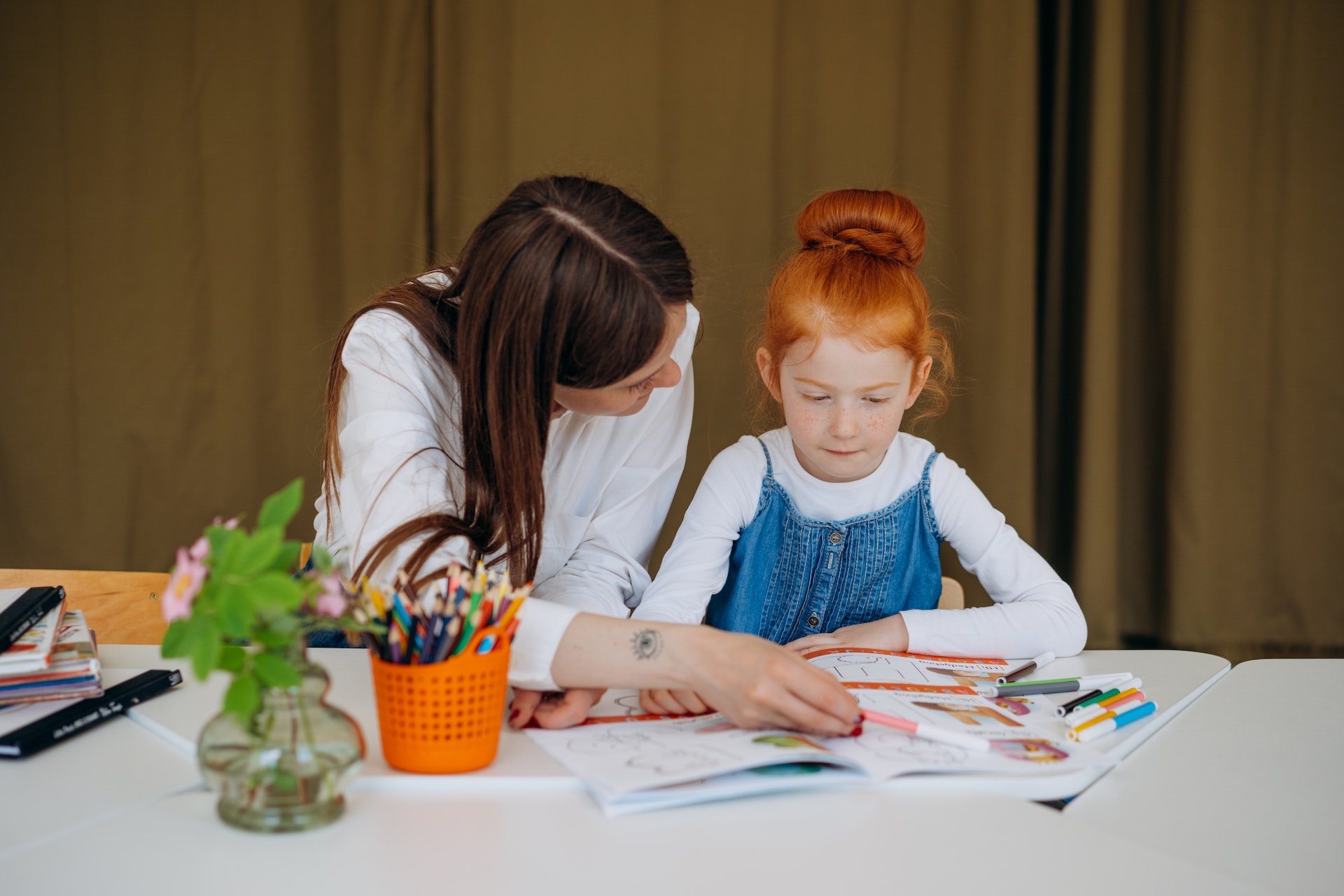 mother homeschooling daughter
