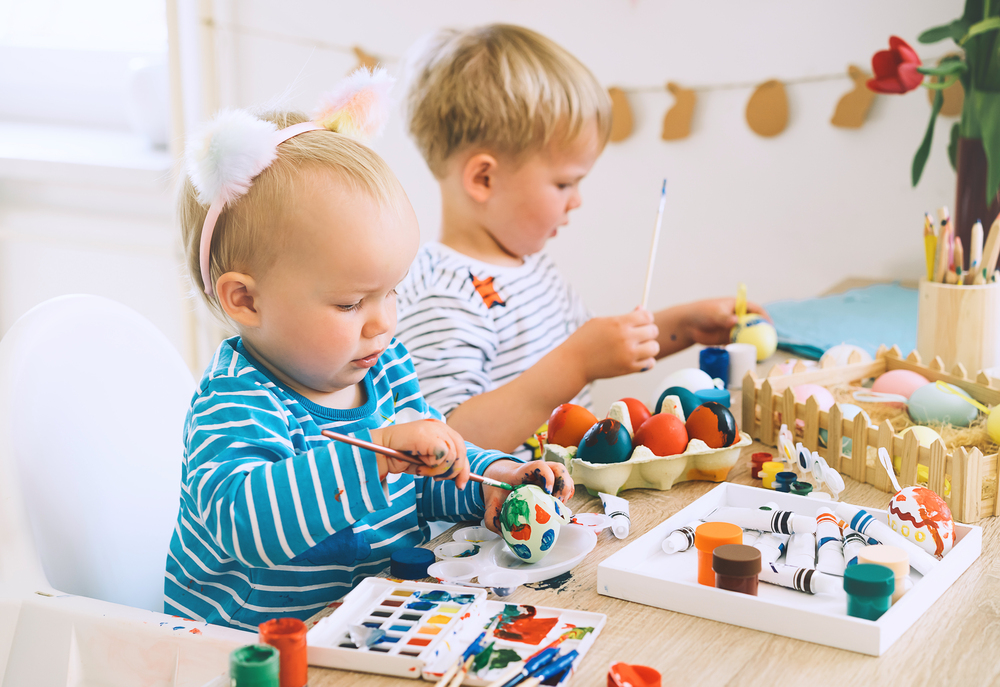 children painting easter eggs