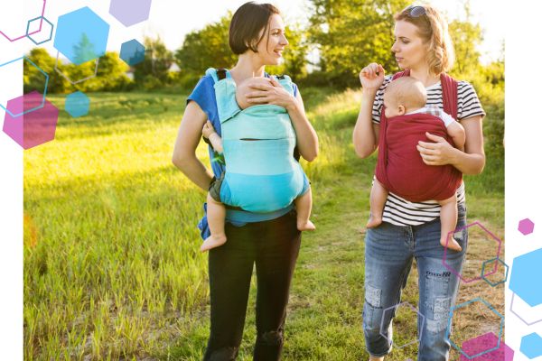 CubCare blog post front cover. Two mums are looking at each other and talking, they are both babywearing their babies in summer. Everyone is dressed in light layers and short sleeves to keep cool whilst babywearing. CubCare blog post front cover. Two mums are looking at each other and talking, they are both babywearing their babies in summer. Everyone is dressed in light layers and short sleeves to keep cool whilst babywearing.