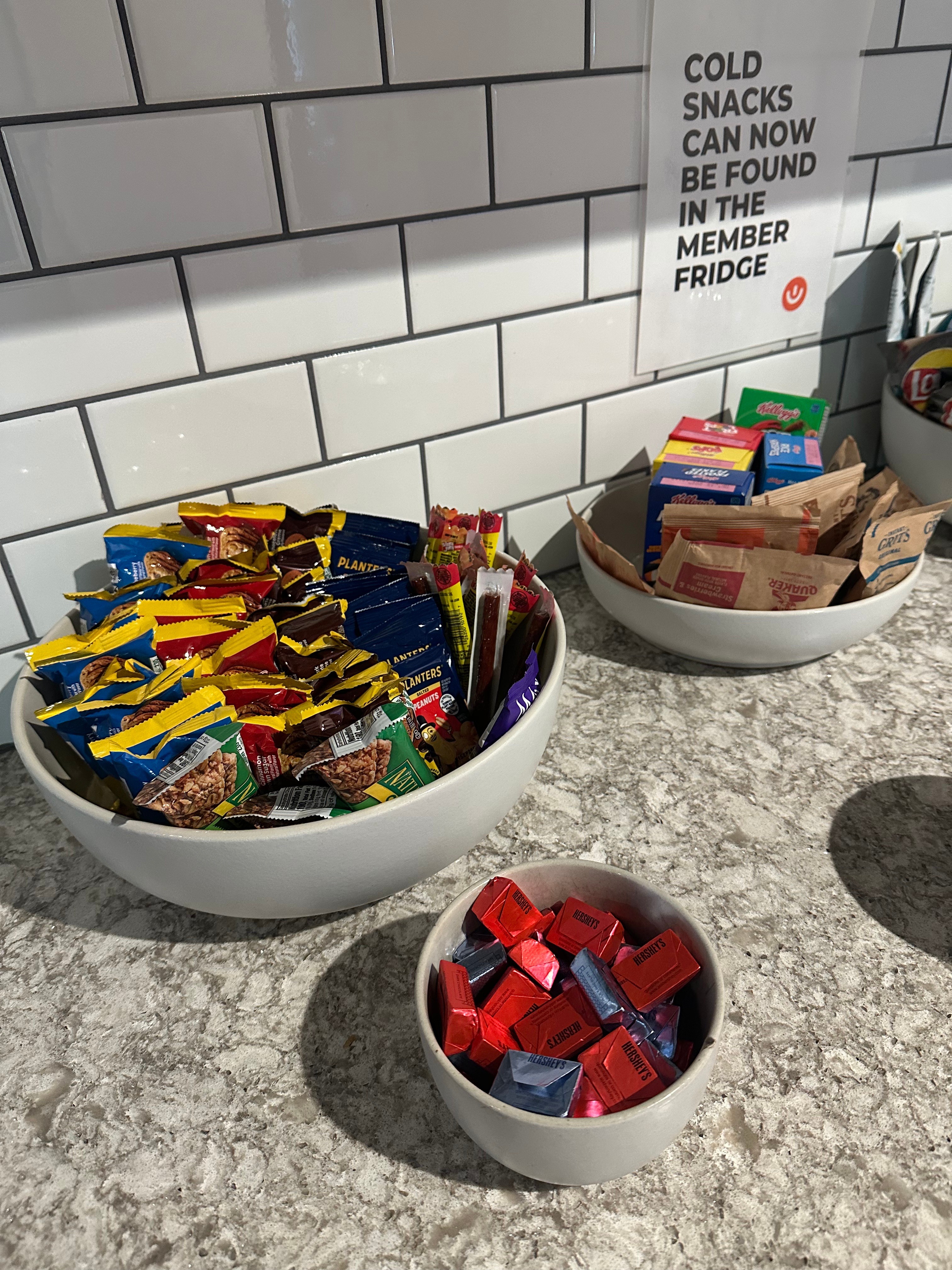 bowls on kitchen counter filled with sugary snacks