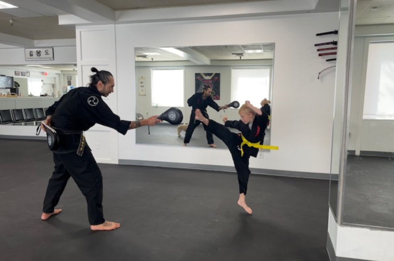 Martial arts instructor with kids